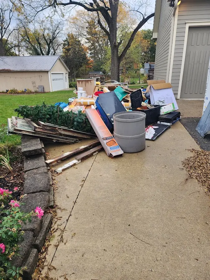 Dumpster being loaded with debris for 3 Yard Dumpster Rental in East Amwell